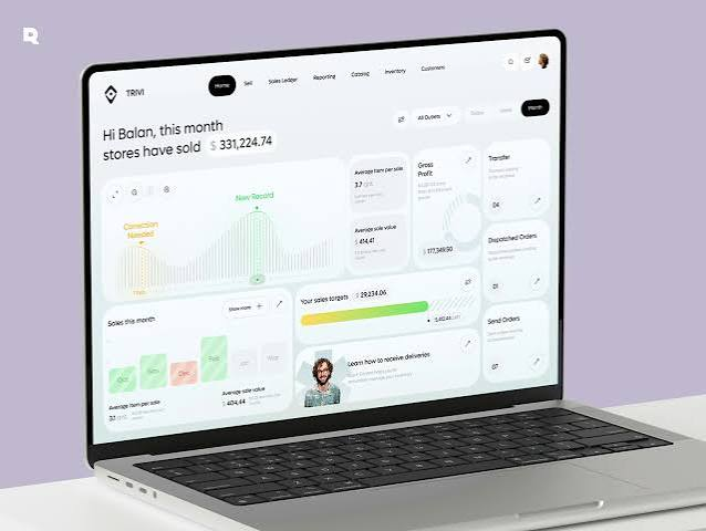 Laptop showing a sales management dashboard